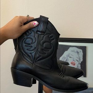 Black shirt cowboy boots